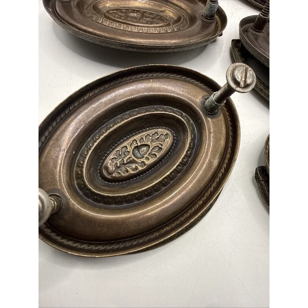 Antique Hepplewhite-style drawer pulls embossed oval backplate